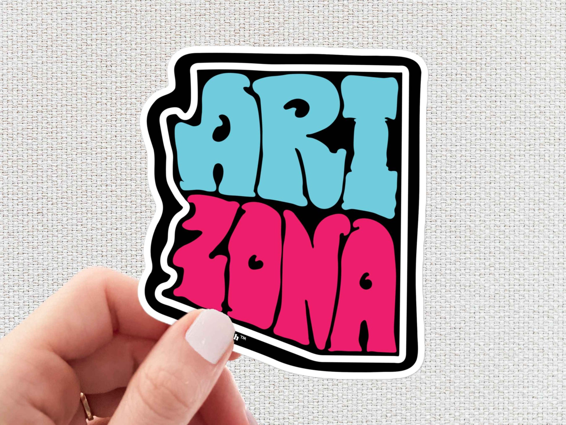 arizona sticker, hand display, white textured background