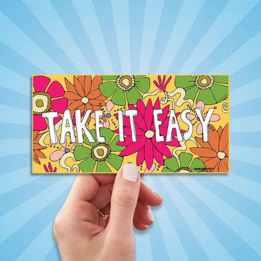 take it easy bumper sticker, hand display, sun rays design background

