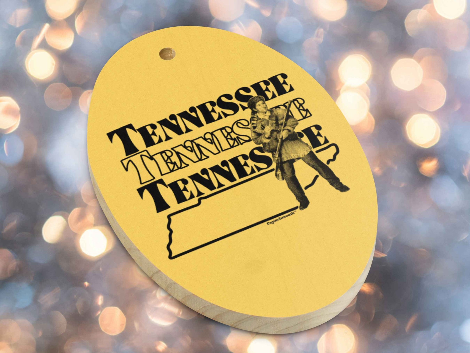 tennessee Christmas ornament, front bottom left side, Christmas lights background