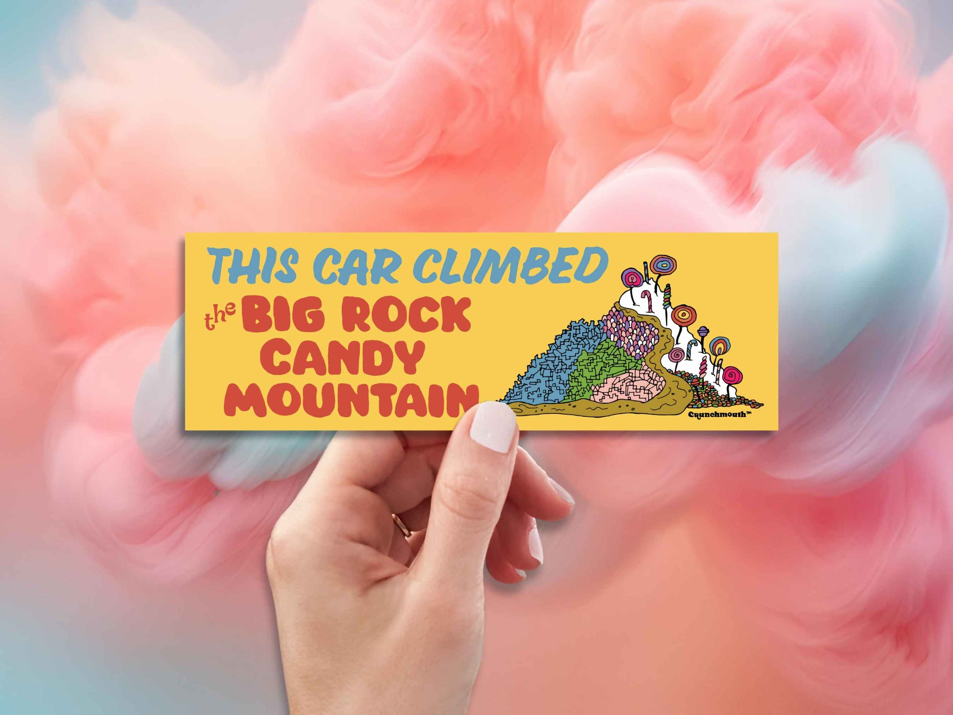 this car climbed the big rock candy mountain, hand display, cotton candy clouds background