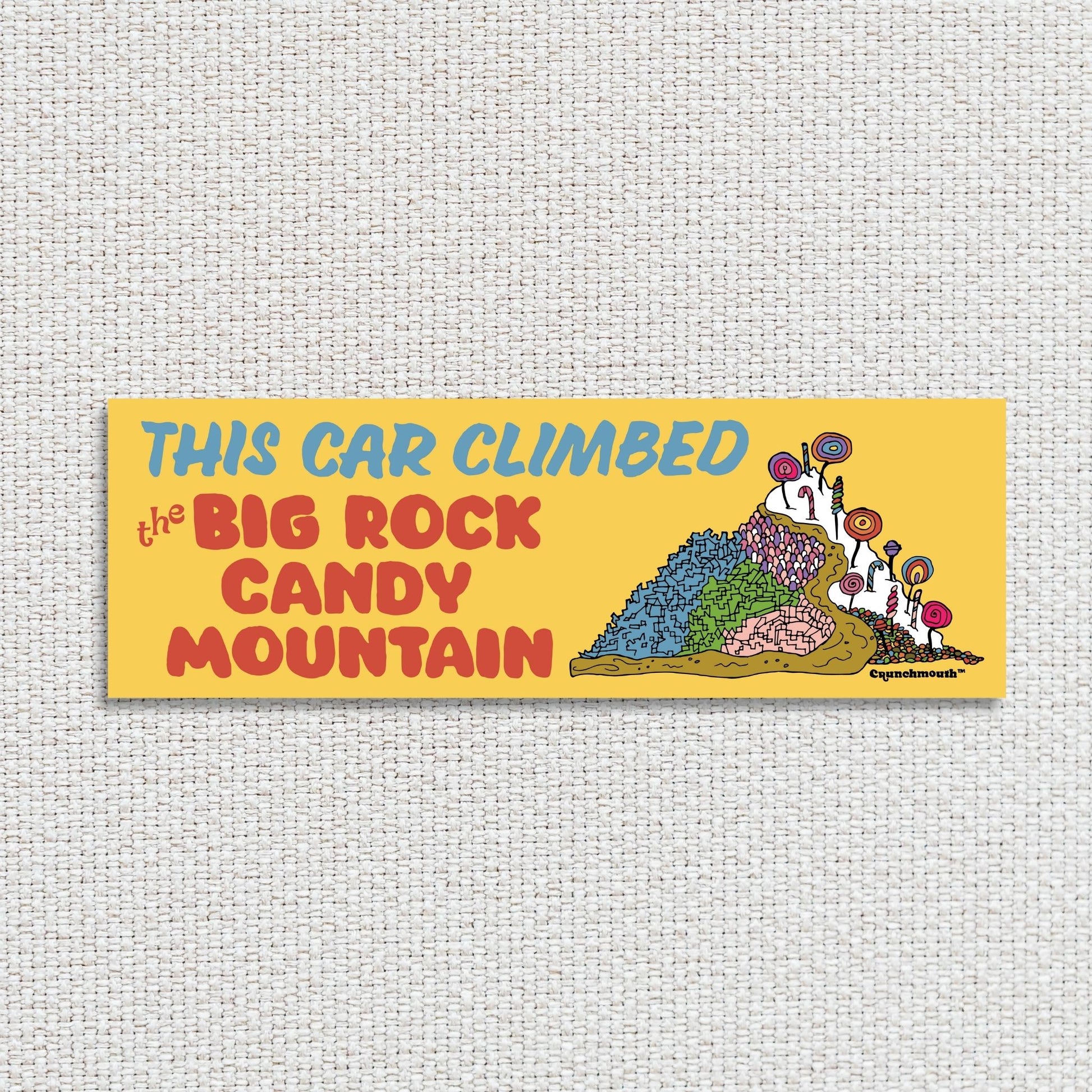 this car climbed the big rock candy mountain bumper sticker, white textured fabric background