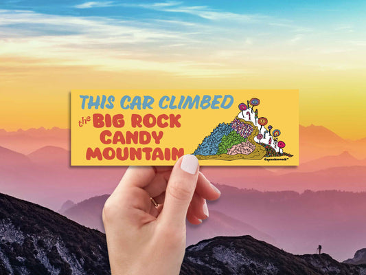 this car climbed the big rock candy mountain, funny bumper stickers, hand display, mountain skyline background