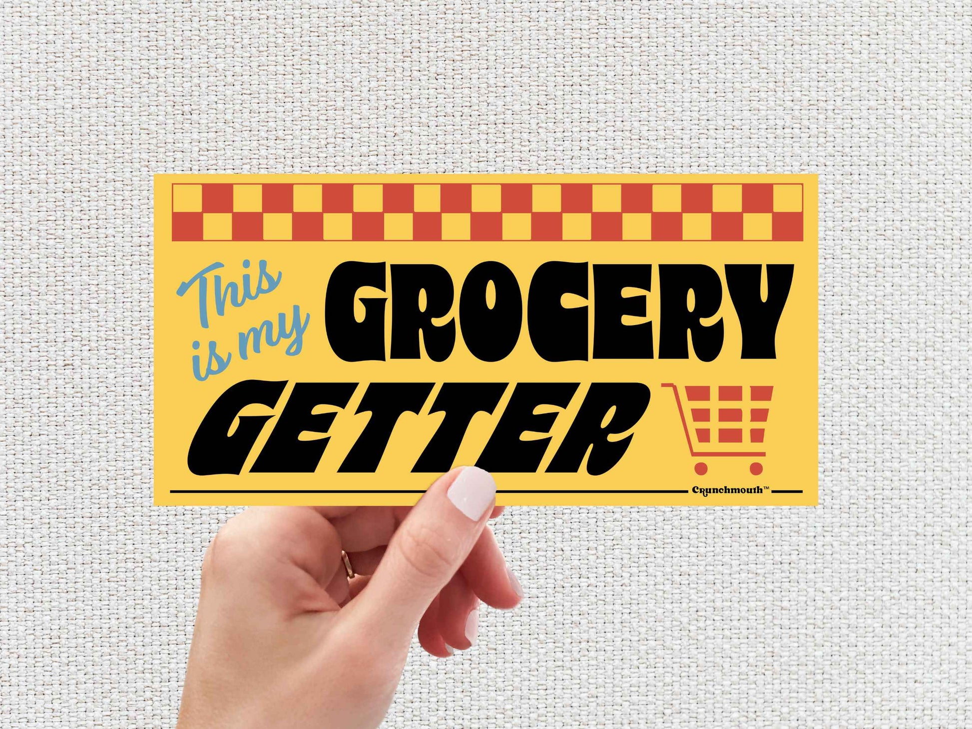 this is my grocery getter bumper sticker, hand display, white textured background