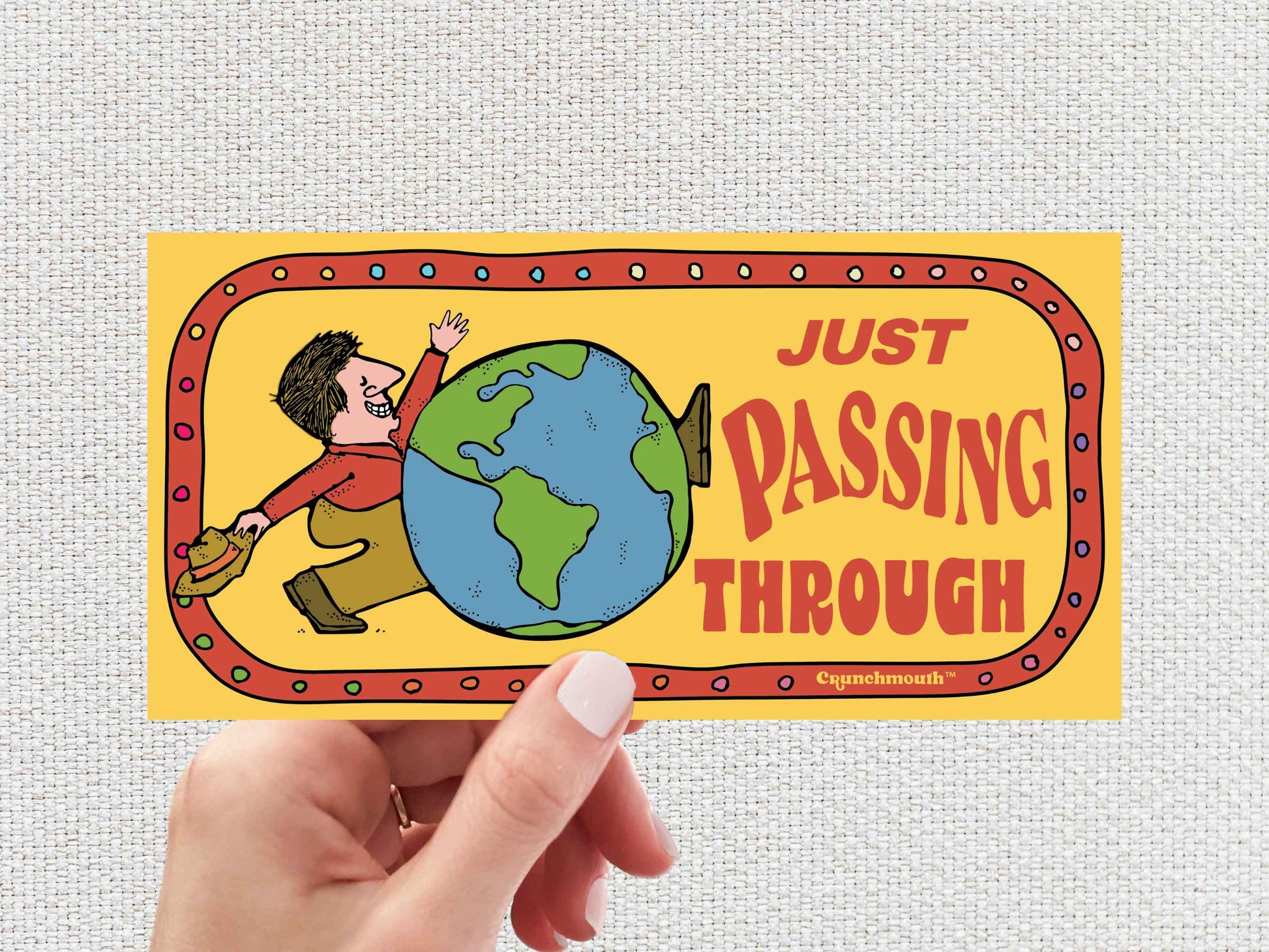 just passing through bumper sticker, hand display, white textured background