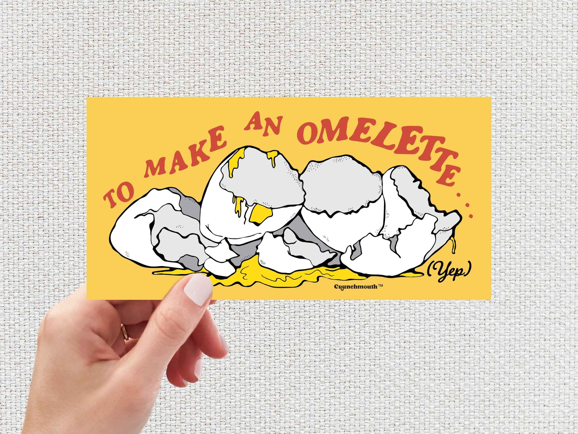 to make an omelette you have to break a few eggs bumper sticker, hand display, white textured background