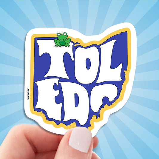 toledo travel luggage sticker, hand display, sun rays design background
