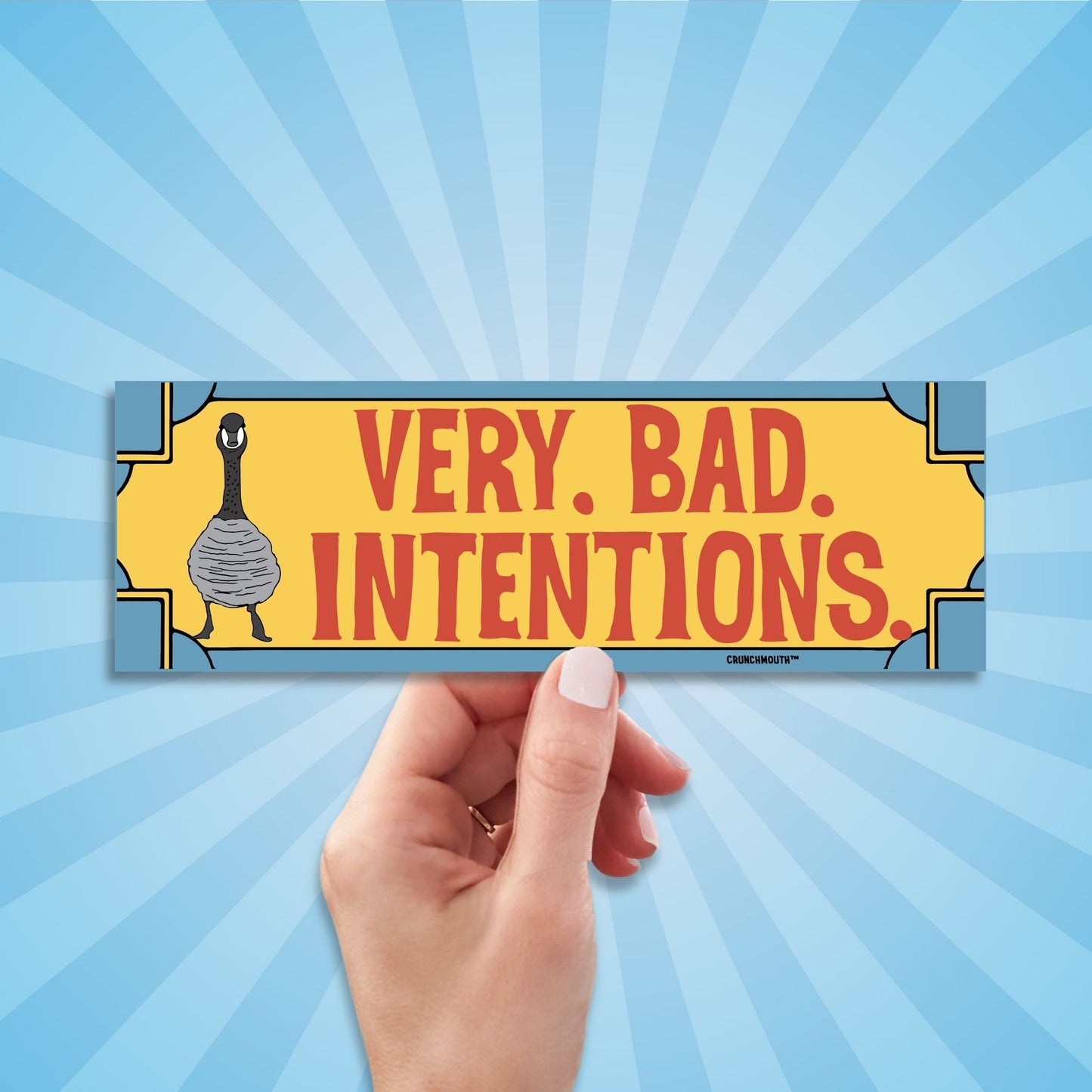 Canada goose bumper sticker, very bad intentions, hand display, sun rays design background
