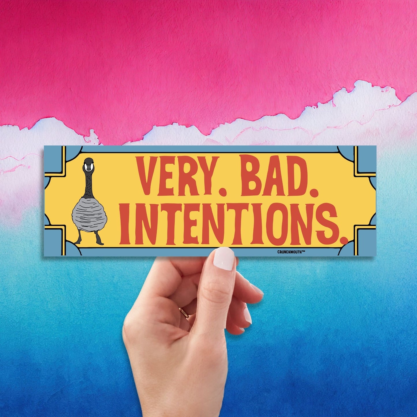 Canada goose bumper sticker, very bad intentions, hand display, retro design background
