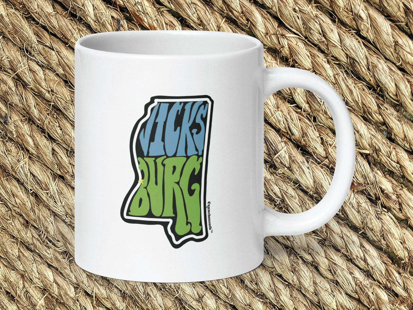 vicksburg mississippi coffee mug, 20oz, handle on right, woven rug background