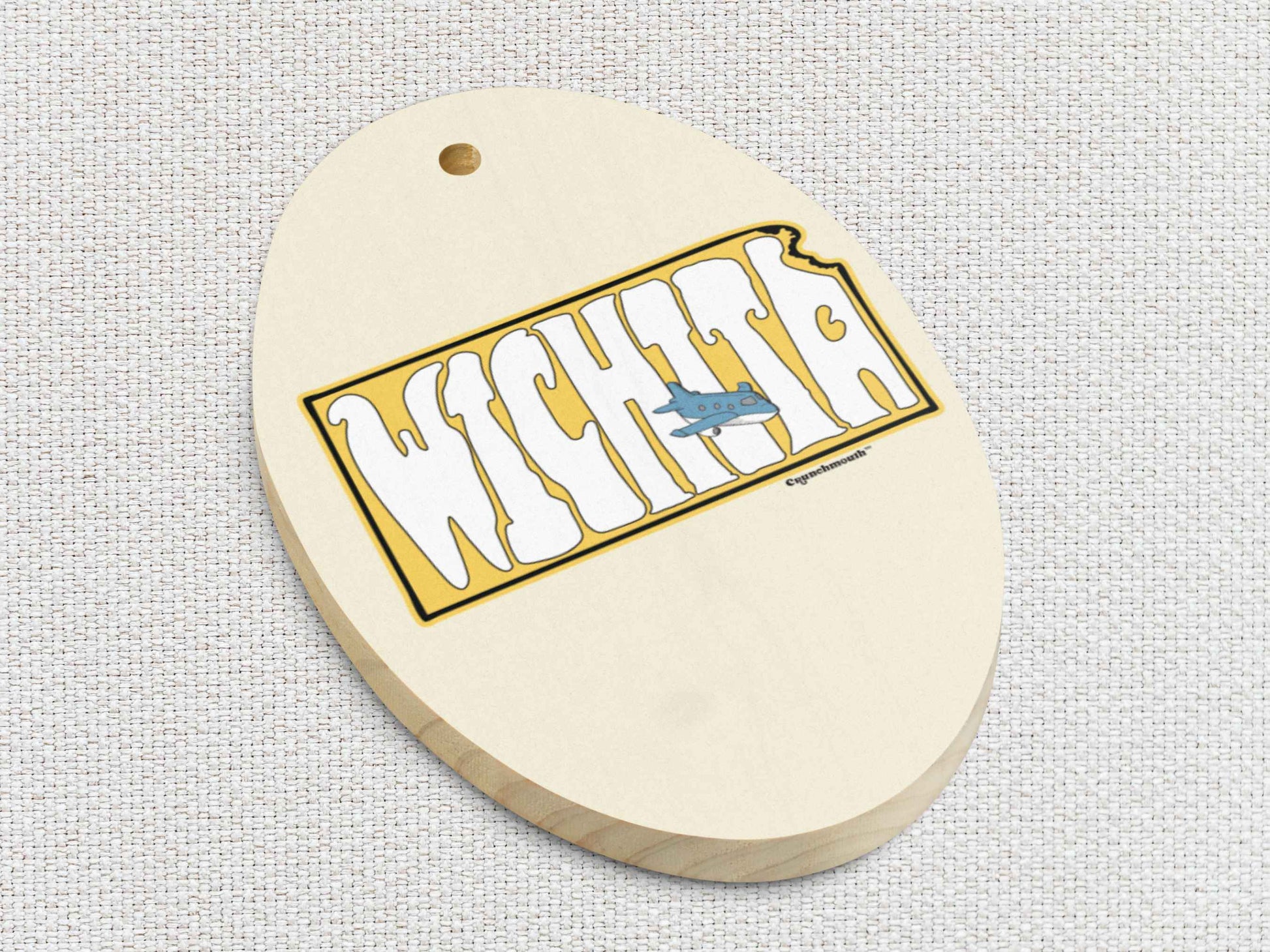 wichita kansas air capital of the world Christmas ornament, front bottom left side, white textured background