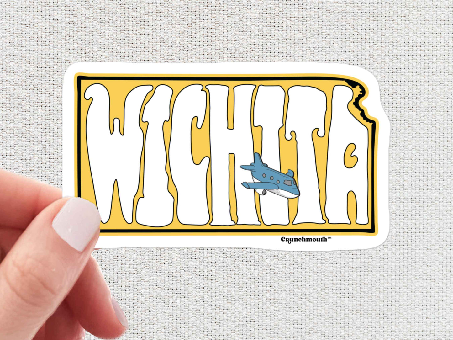 wichita travel luggage sticker, air capital of the world, hand display, white textured background