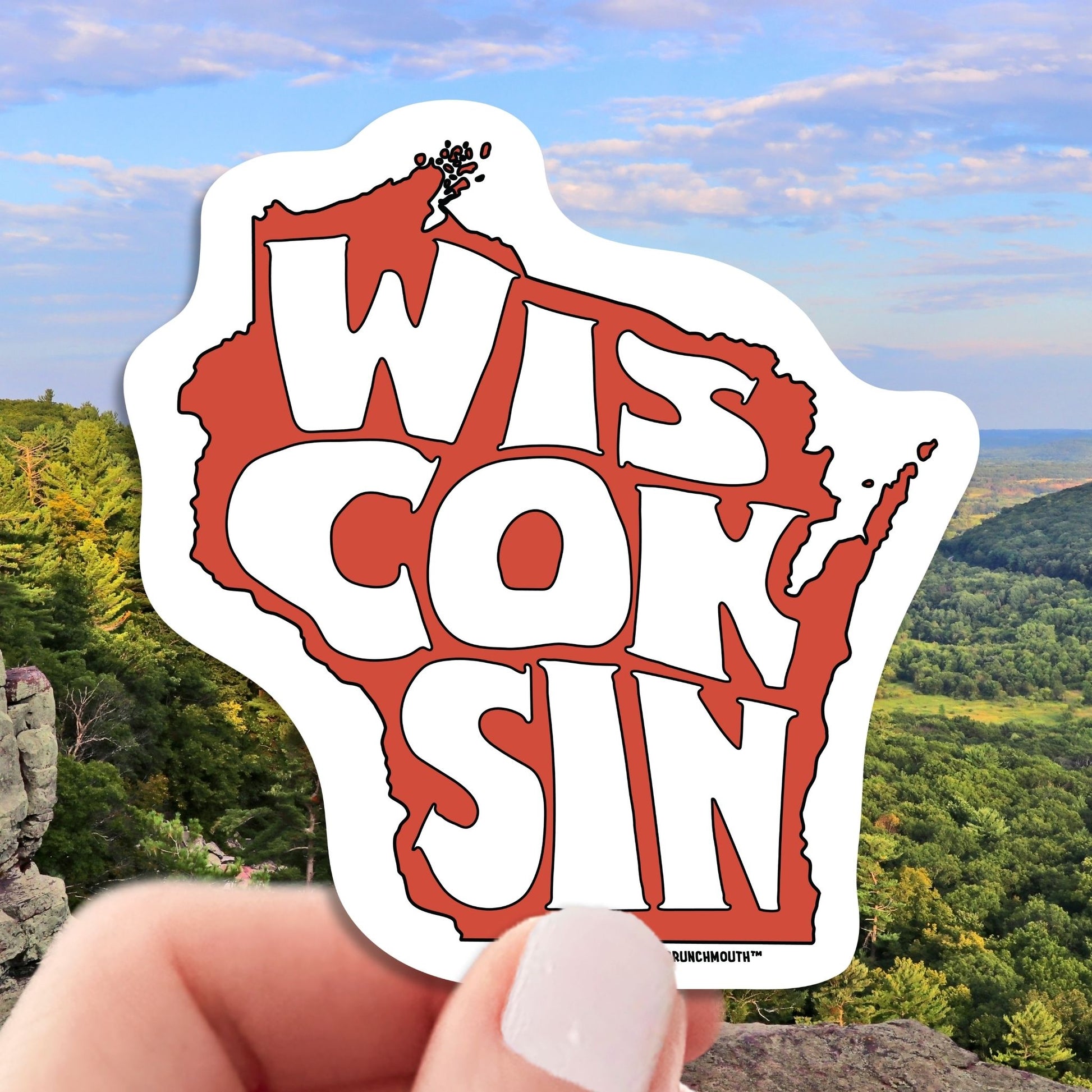 state of wisconsin travel luggage sticker, hand display, wisconsin landscape background