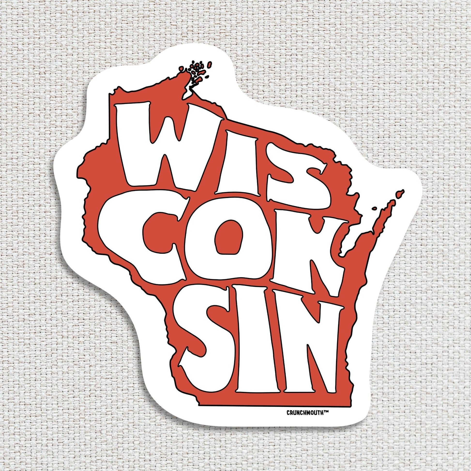 state of wisconsin travel luggage sticker, hand display, textured fabric background
