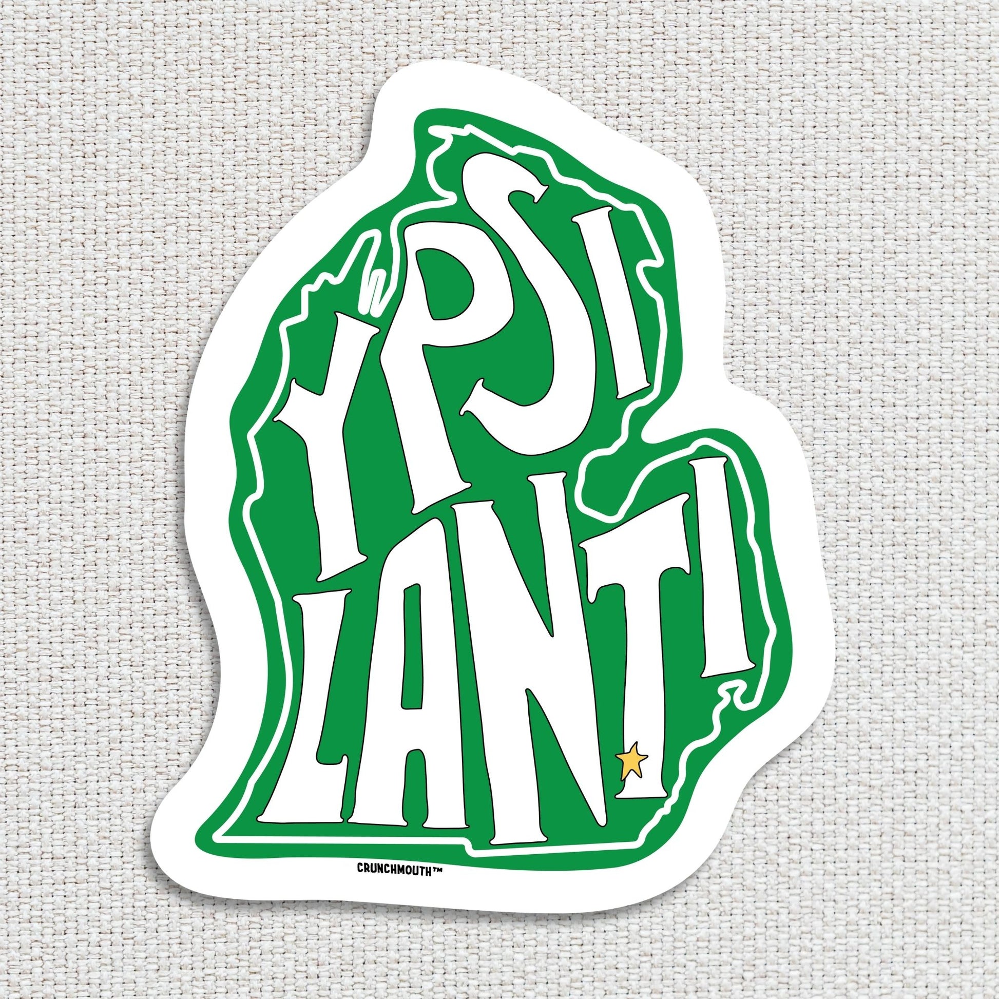 ypsilanti michigan travel luggage sticker, hand display, textured fabric background