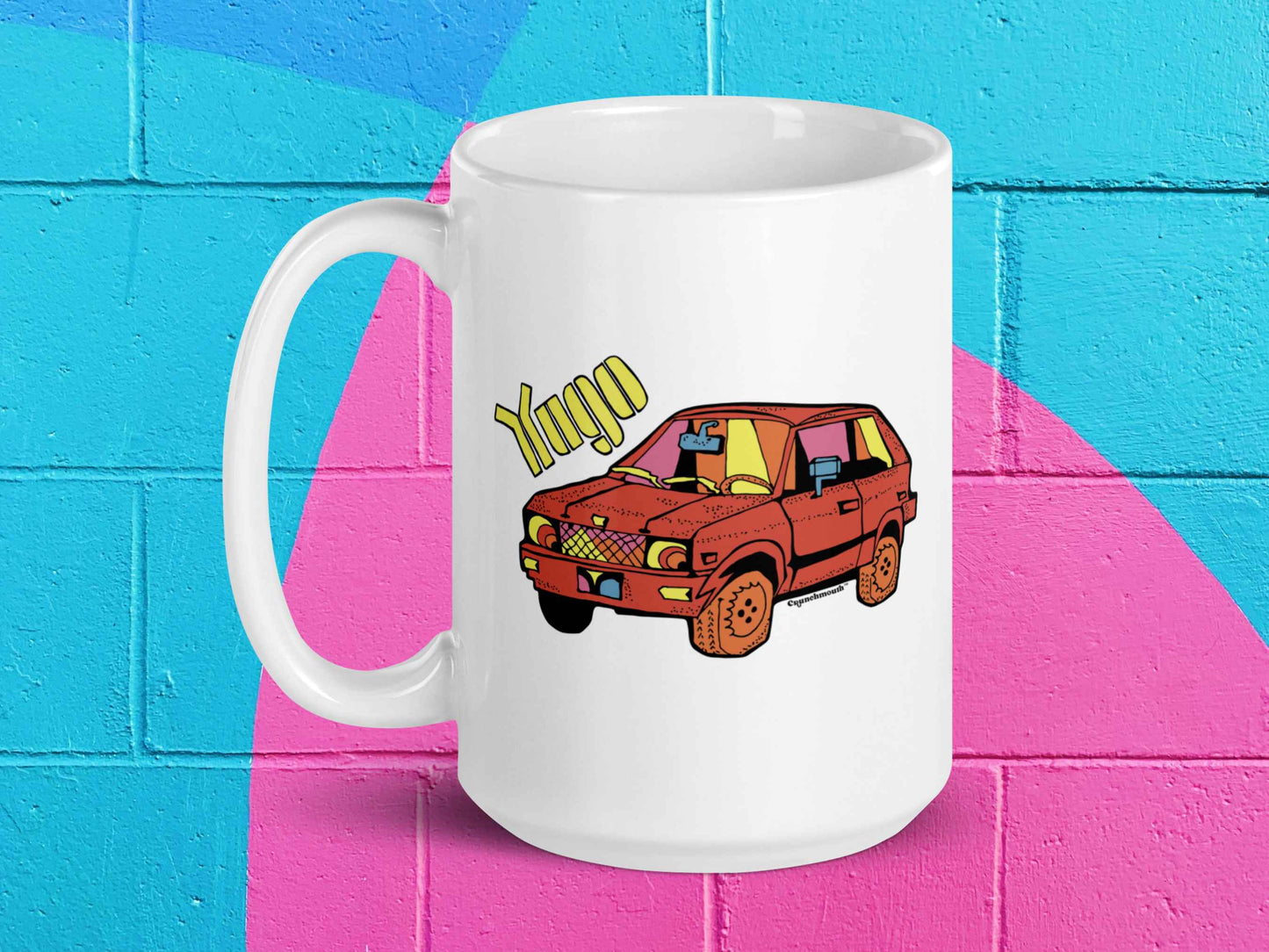 yugo coffee mug, yugo gv, 15 oz, handle on left, vibrant color cinder block wall background