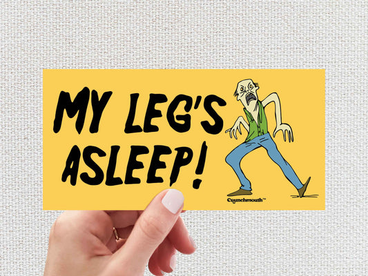 my leg's asleep bumper sticker, funny zombie sticker, hand display, white textured background